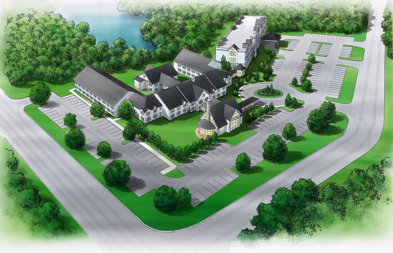 Aerial illustrated view of New Standard Senior Living at Millville facility showing multiple connected buildings with pitched roofs surrounded by parking lots, green lawns, trees, and a small pond in the background.
